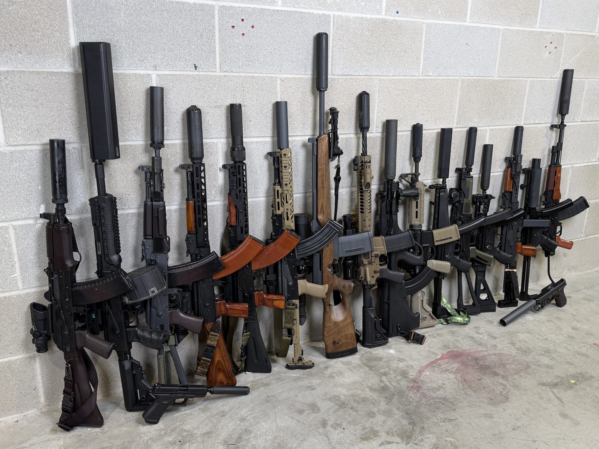 Can you name all the guns and suppressors in this picture?